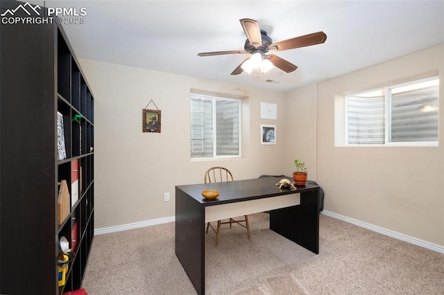 office with baseboards, a ceiling fan, carpet flooring, and a wealth of natural light