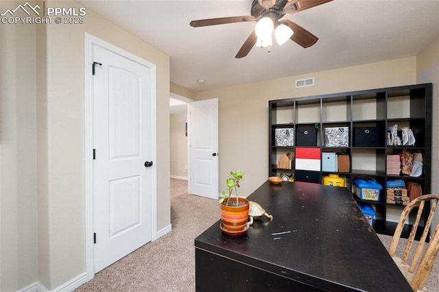 office area featuring baseboards, visible vents, carpet, and ceiling fan