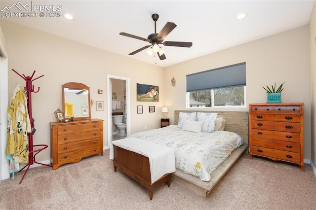 bedroom featuring recessed lighting, ensuite bath, a ceiling fan, and light carpet