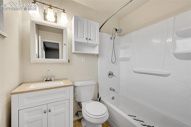 full bathroom featuring toilet, vanity, and shower / washtub combination