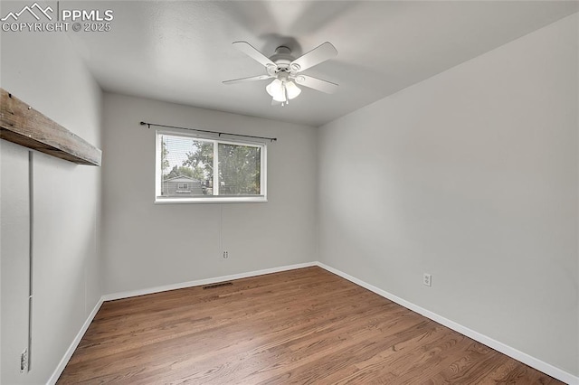 unfurnished bedroom with baseboards, visible vents, a closet, and wood finished floors