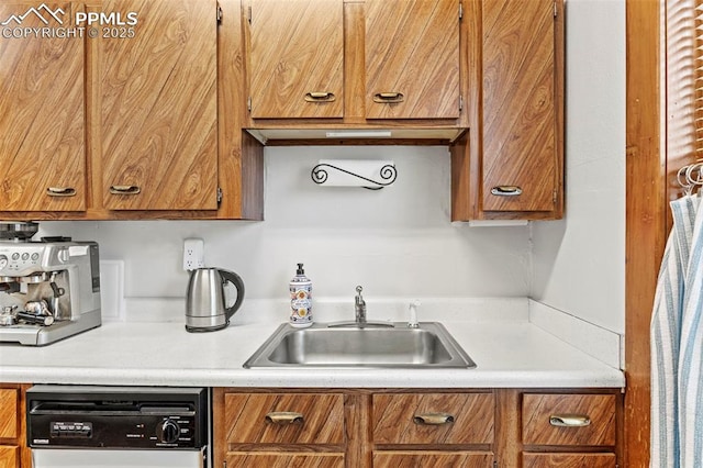1336 N Weber St, Colorado Springs, CO 80903 - kitchen featuring a sink, light countertops, brown cabinets, and dishwasher