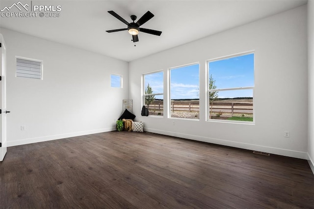 6678 Thimble Ct, Colorado Springs, CO 80924 - spare room featuring baseboards, dark wood finished floors, and ceiling fan
