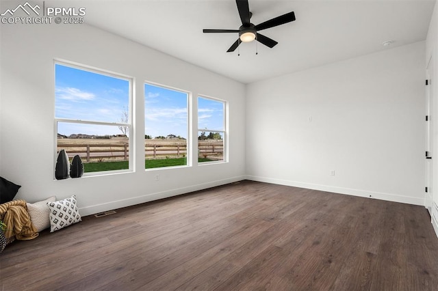 6678 Thimble Ct, Colorado Springs, CO 80924 - unfurnished room with dark wood-type flooring, baseboards, and a ceiling fan