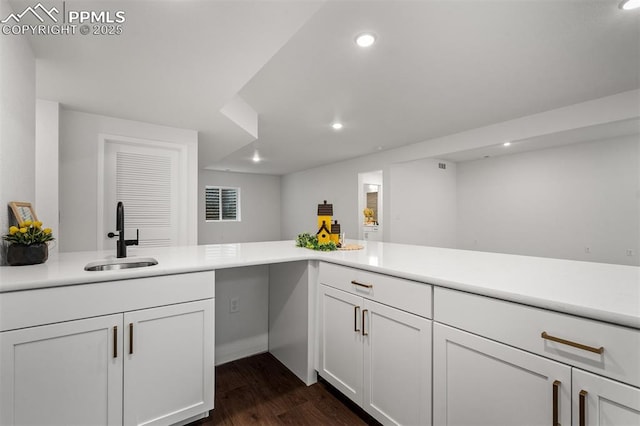 6678 Thimble Ct, Colorado Springs, CO 80924 - kitchen with a sink, light countertops, recessed lighting, white cabinetry, and dark wood-type flooring