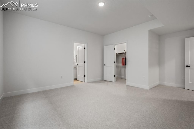 6678 Thimble Ct, Colorado Springs, CO 80924 - unfurnished bedroom featuring light colored carpet, baseboards, a walk in closet, and connected bathroom