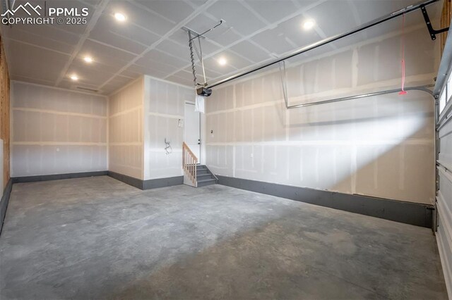 6678 Thimble Ct, Colorado Springs, CO 80924 - garage featuring a garage door opener and recessed lighting