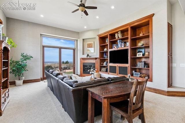 3870 S Club Dr, Colorado Springs, CO 80906 - living area featuring light colored carpet, ceiling fan, baseboards, and recessed lighting