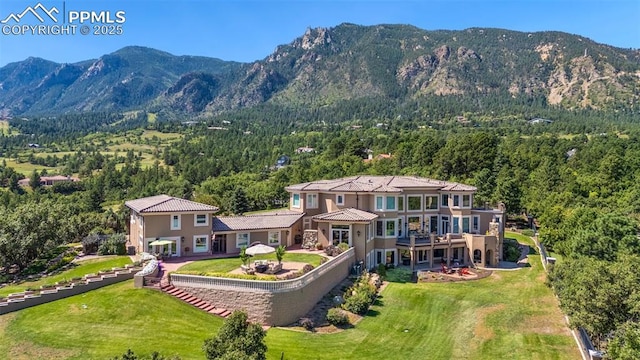 3870 S Club Dr, Colorado Springs, CO 80906 - exterior space featuring a wooded view and a mountain view