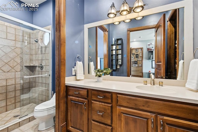 3870 S Club Dr, Colorado Springs, CO 80906 - full bathroom with toilet, vanity, and a stall shower