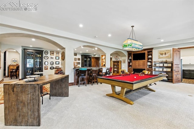 3870 S Club Dr, Colorado Springs, CO 80906 - recreation room featuring billiards, recessed lighting, a bar, arched walkways, and light colored carpet
