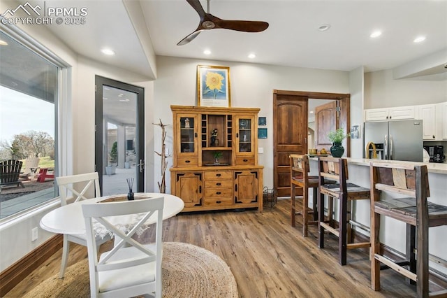 3870 S Club Dr, Colorado Springs, CO 80906 - dining space with light wood-type flooring, a ceiling fan, and recessed lighting