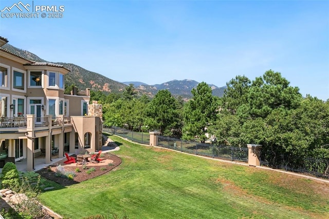 3870 S Club Dr, Colorado Springs, CO 80906 - view of yard featuring a patio, a mountain view, and a fenced backyard