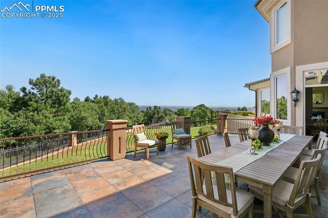 3870 S Club Dr, Colorado Springs, CO 80906 - view of patio / terrace featuring outdoor dining space and fence