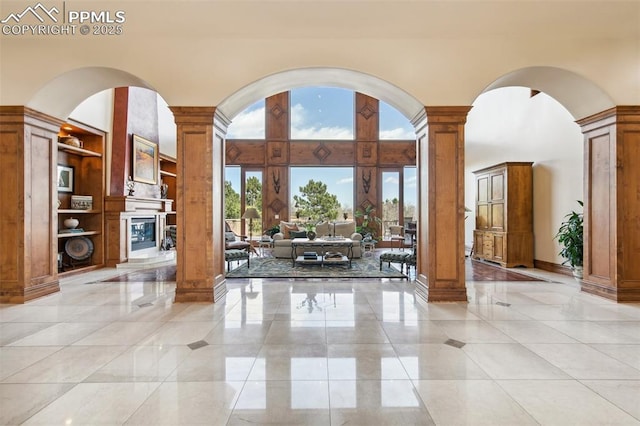 3870 S Club Dr, Colorado Springs, CO 80906 - interior space with arched walkways, a high ceiling, and ornate columns