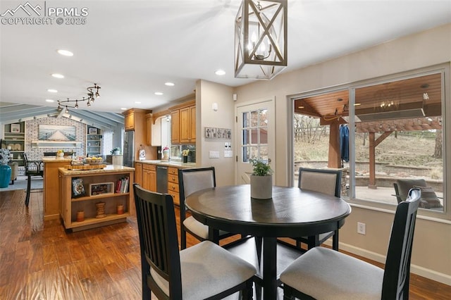 dining room with baseboards, dark wood-style floors, and recessed lighting