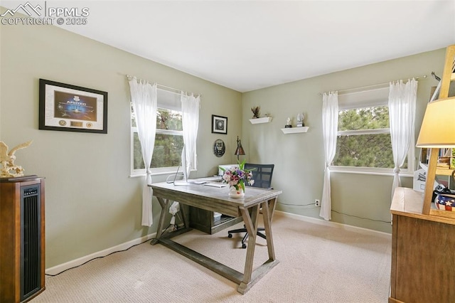 carpeted office with baseboards and plenty of natural light