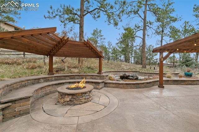 view of patio with an outdoor fire pit
