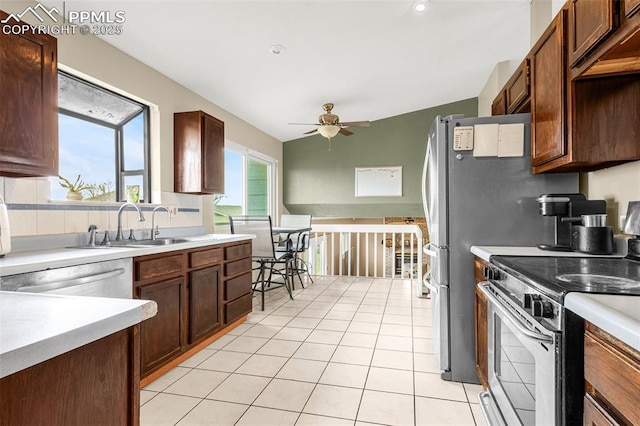 7775 Woody Creek Dr, Colorado Springs, CO 80911 - kitchen featuring light countertops, light tile patterned floors, stainless steel appliances, a sink, and a ceiling fan