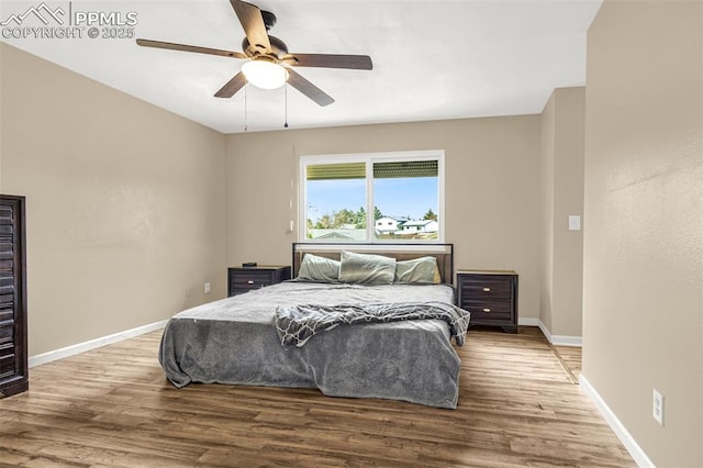 7775 Woody Creek Dr, Colorado Springs, CO 80911 - bedroom featuring baseboards, ceiling fan, and wood finished floors