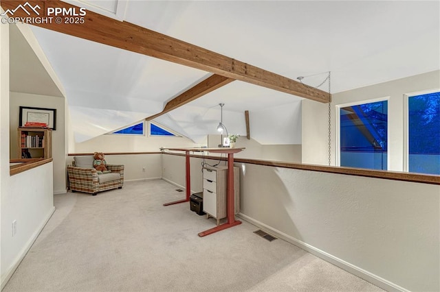 2372 Wood Ave, Colorado Springs, CO 80907 - interior space featuring carpet flooring, vaulted ceiling with beams, baseboards, and visible vents