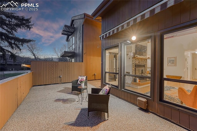 2372 Wood Ave, Colorado Springs, CO 80907 - patio terrace at dusk featuring fence