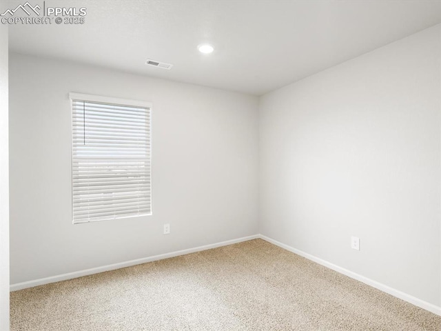 unfurnished room with recessed lighting, visible vents, carpet flooring, and baseboards