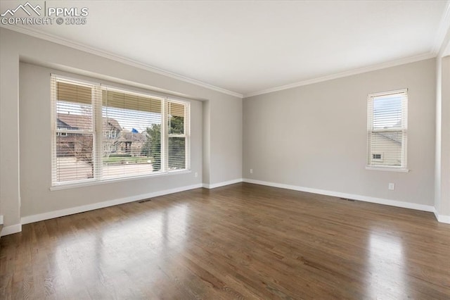 15110 Copperfield Dr, Colorado Springs, CO 80921 - empty room with dark wood-type flooring, ornamental molding, baseboards, and a healthy amount of sunlight