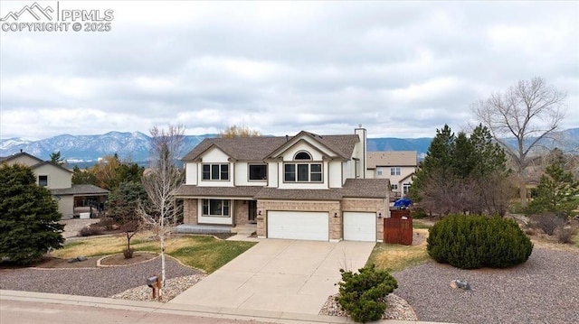 15110 Copperfield Dr, Colorado Springs, CO 80921 - traditional-style house with a garage, brick siding, driveway, and a mountain view