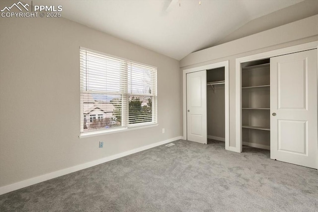 15110 Copperfield Dr, Colorado Springs, CO 80921 - unfurnished bedroom featuring baseboards, carpet flooring, vaulted ceiling, and multiple closets