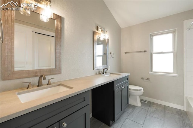15110 Copperfield Dr, Colorado Springs, CO 80921 - full bathroom with double vanity, a sink, toilet, and lofted ceiling