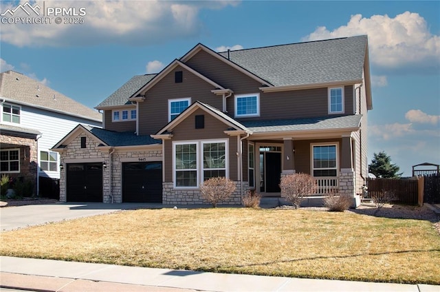 9443 St George Rd, Peyton, CO 80831 - craftsman inspired home featuring a front yard, a shingled roof, stone siding, fence, and concrete driveway