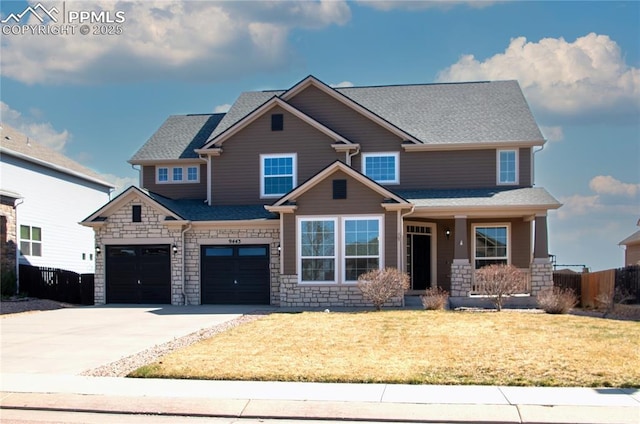 9443 St George Rd, Peyton, CO 80831 - craftsman house with concrete driveway, stone siding, and fence