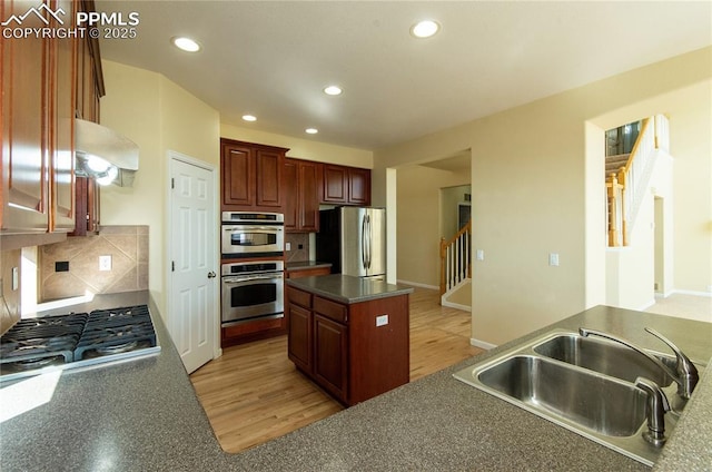 9443 St George Rd, Peyton, CO 80831 - kitchen with recessed lighting, backsplash, dark countertops, appliances with stainless steel finishes, and a sink