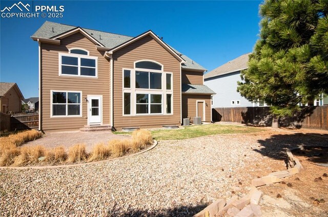 9443 St George Rd, Peyton, CO 80831 - back of property featuring a patio, a fenced backyard, and entry steps