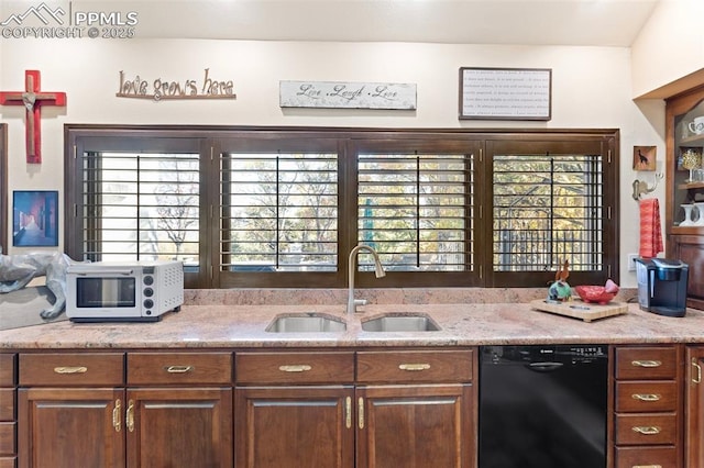 714 Southern Cross Pl, Colorado Springs, CO 80906 - kitchen with light stone countertops, dishwasher, a sink, and plenty of natural light