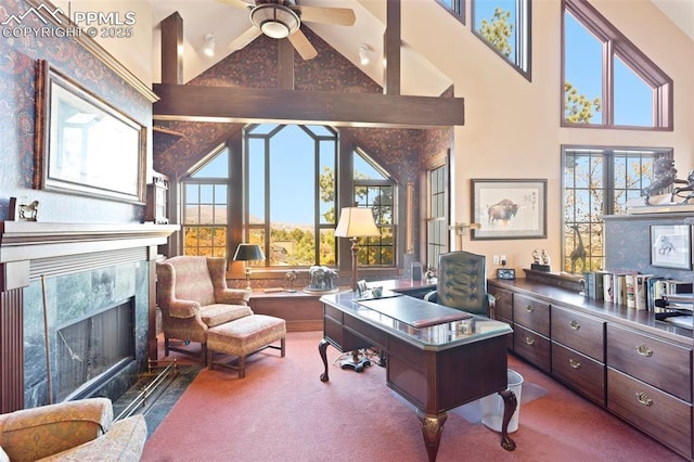 714 Southern Cross Pl, Colorado Springs, CO 80906 - carpeted home office with high vaulted ceiling, plenty of natural light, a premium fireplace, and a ceiling fan