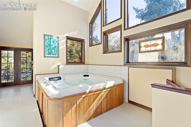 714 Southern Cross Pl, Colorado Springs, CO 80906 - full bathroom featuring a bath, high vaulted ceiling, and tile patterned floors