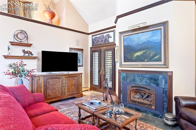 714 Southern Cross Pl, Colorado Springs, CO 80906 - living room with lofted ceiling, baseboard heating, and a premium fireplace