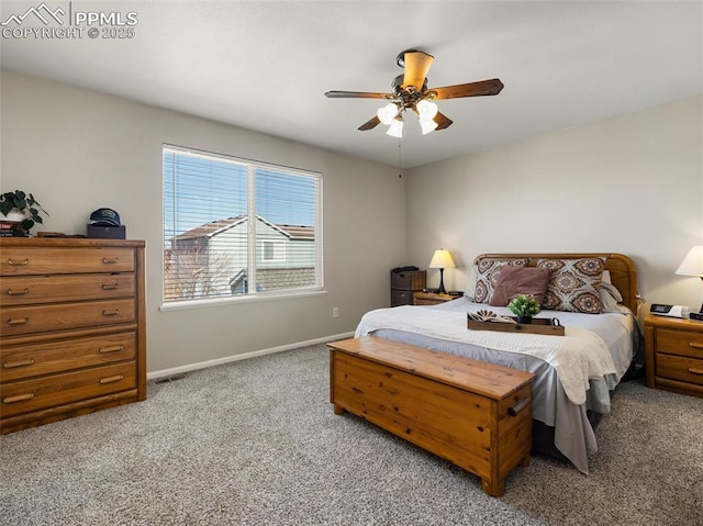 bedroom with carpet flooring, visible vents, baseboards, and ceiling fan