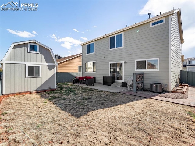 back of property featuring central AC unit, entry steps, fence, a patio, and an outbuilding