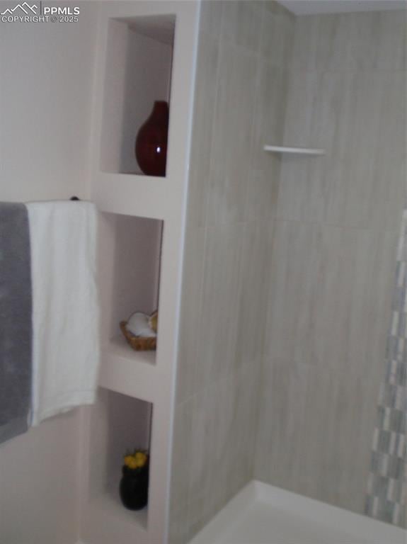 2112 Denton Grv Unit 101, Colorado Springs, CO 80919 - full bath featuring a tile shower