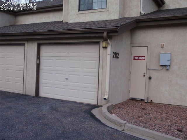2112 Denton Grv Unit 101, Colorado Springs, CO 80919 - garage with driveway