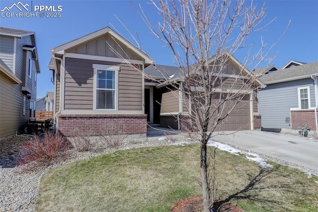 17718 Leisure Lake Dr, Monument, CO 80132 - view of front of home featuring brick siding, driveway, board and batten siding, a garage, and a front yard