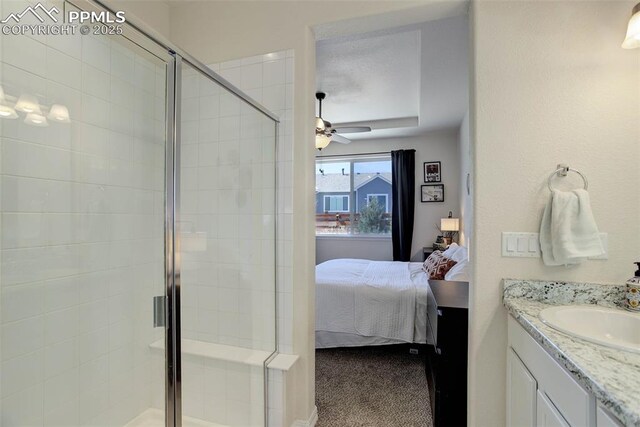 17718 Leisure Lake Dr, Monument, CO 80132 - bathroom featuring ensuite bath, a stall shower, vanity, and ceiling fan