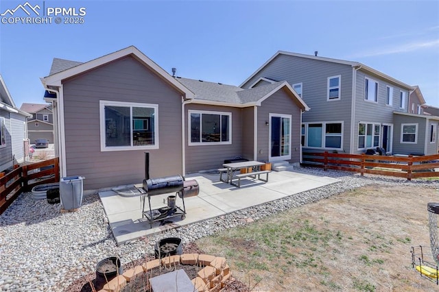 17718 Leisure Lake Dr, Monument, CO 80132 - back of property with a fenced backyard, a patio area, an outdoor fire pit, and entry steps