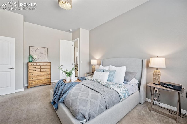 bedroom with carpet floors and baseboards