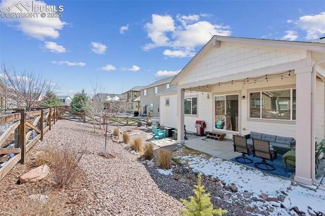 view of yard featuring fence and a patio