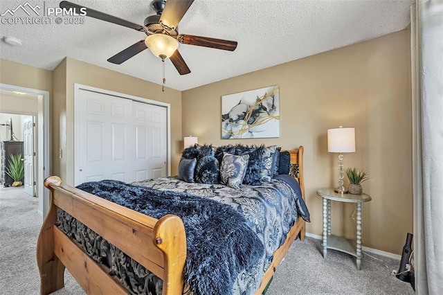 bedroom featuring a ceiling fan, a textured ceiling, a closet, baseboards, and carpet flooring