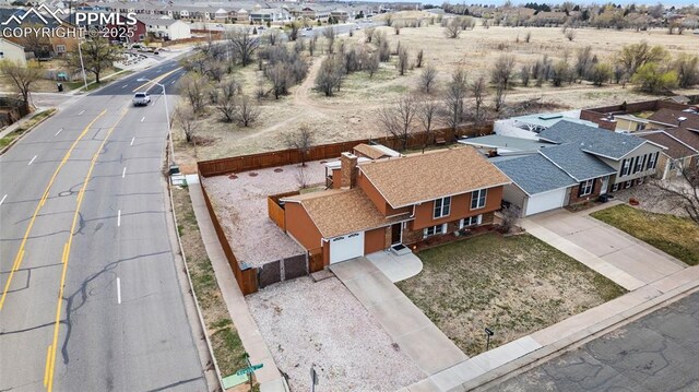 birds eye view of property with a residential view
